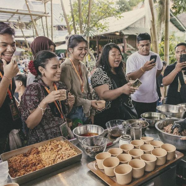 Guests film a chef's live demo on their phones